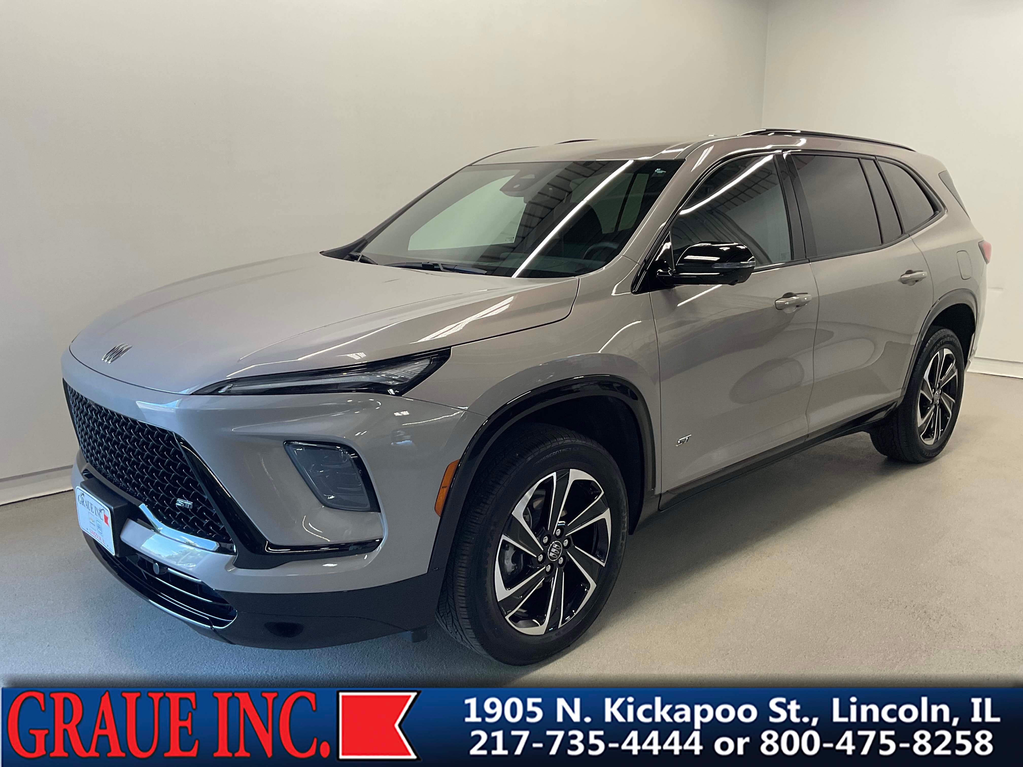 2026 Buick Enclave Sport Touring in Stone Metallic — front three-quarter view